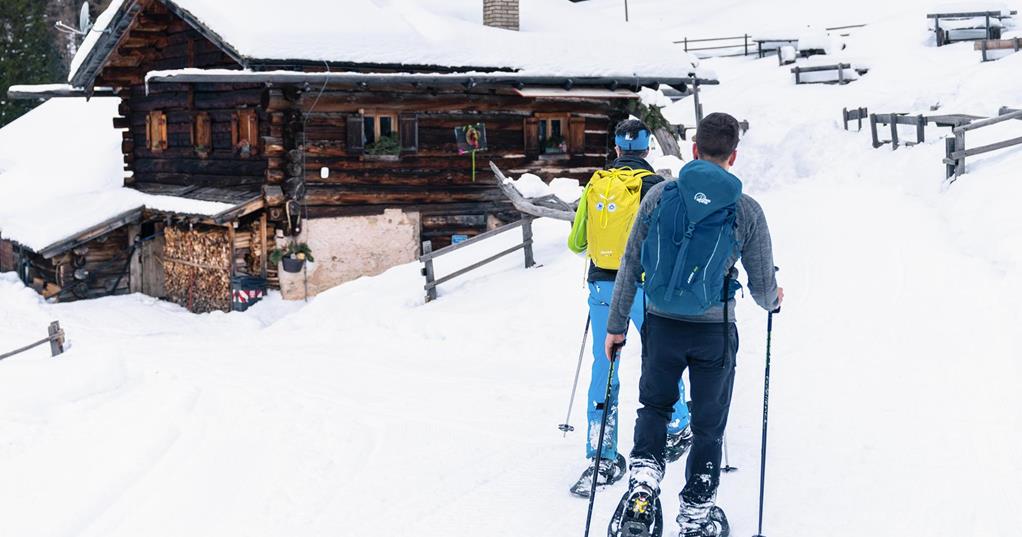 Snowshoe hikers reach a hut