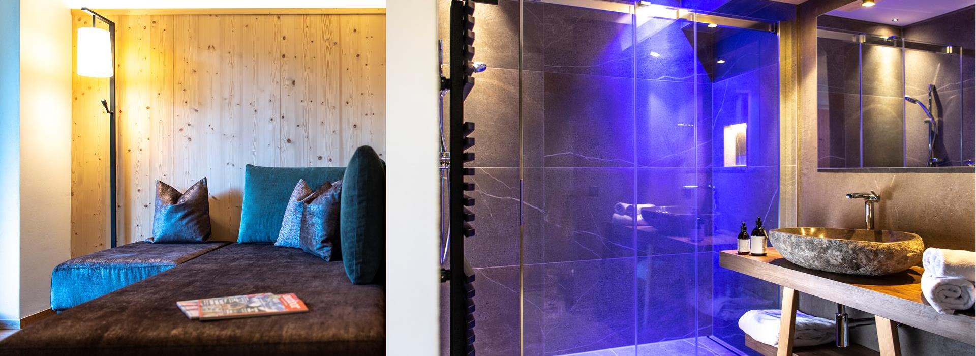 Badezimmer mit Dusche und Wohnraum mit Couch Studio Alpin